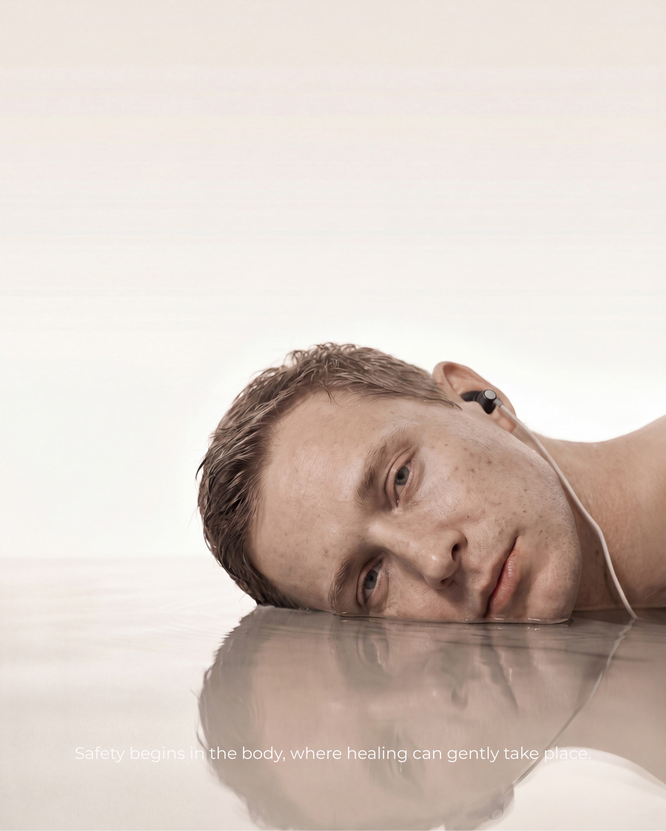 man using ear based tavns device for relaxation routine