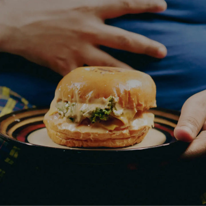 Person eating a meal while considering how stress and digestion are connected