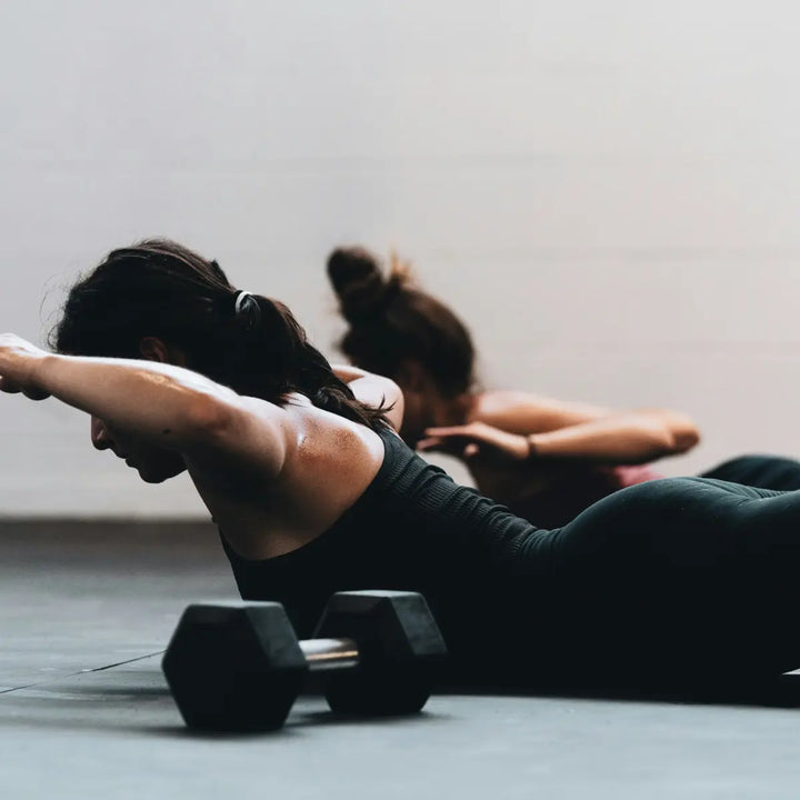 People doing gentle exercise in a wellness fitness setting
